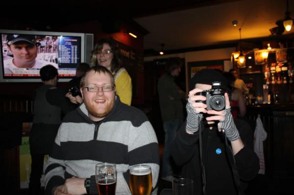 Lil takes a photo at the same time as Chris.