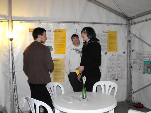 Zoltan talks people through the posters.