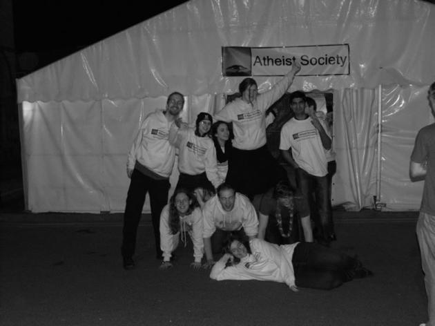The team posing outside the tent.