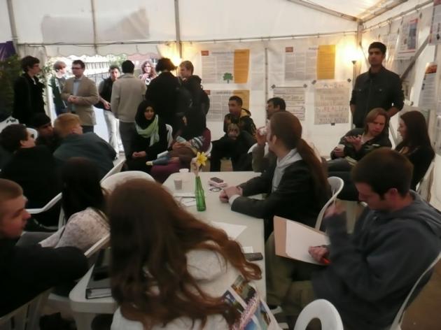 The debates fill the tent.
