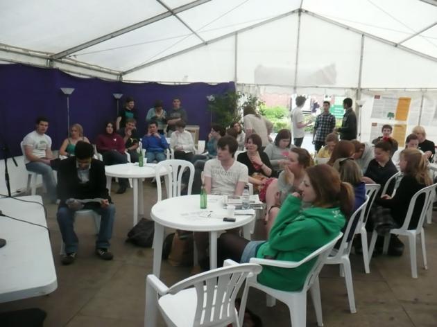 The debates fill the tent.