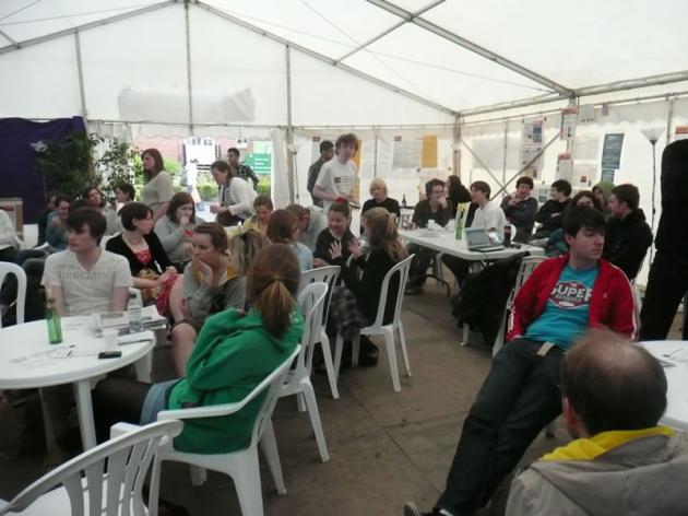 The debates fill the tent.