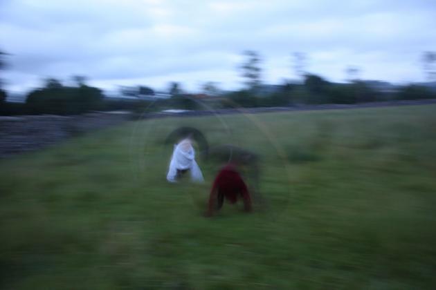 Nicola and Rosie cartwheeling.