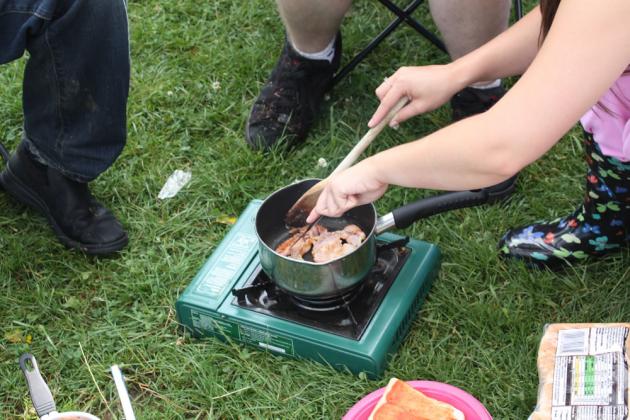 Cooking bacon sandwiches.
