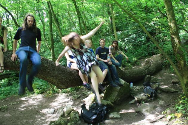 Jumping off the fallen tree.