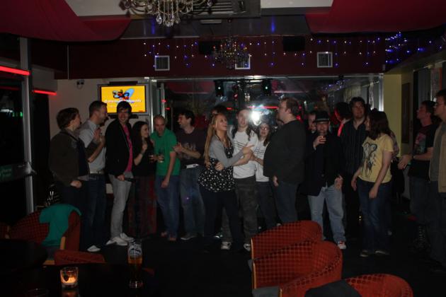 Everyone gets up to sing.