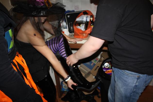 Kat trying on Chris's boots.