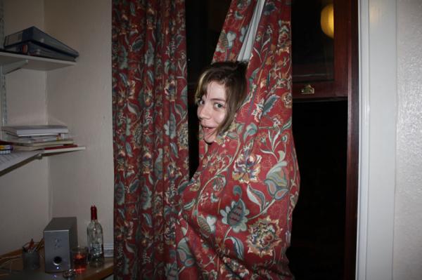 Sophie hiding in the curtains.