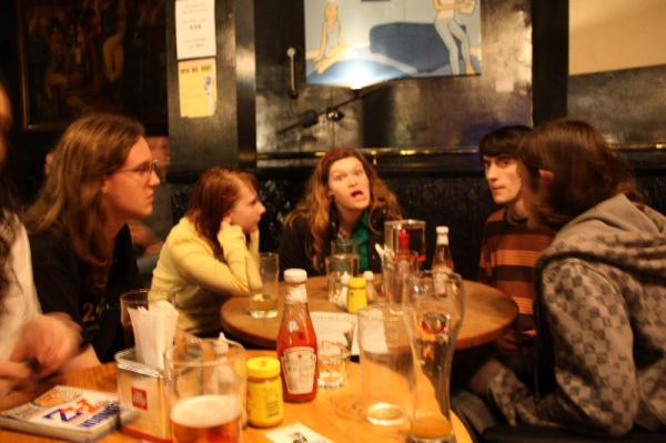 Everyone having dinner at the pub.