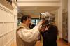 Nicola tries a knight's helmet on.