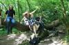 Jumping off the fallen tree.