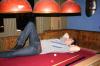 Rich does a photoshoot on the pool table.
